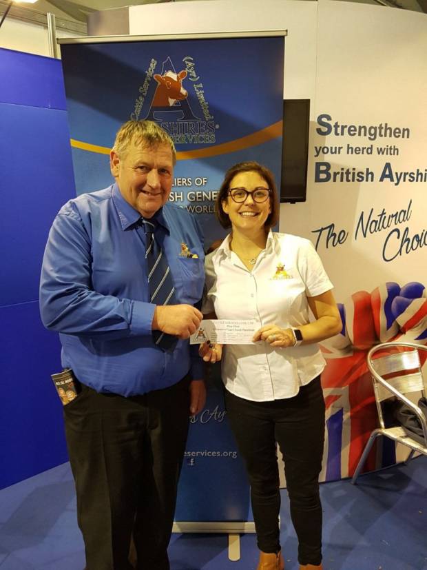 Pictured is Society President Philip Williams and Ayrshire General Manager Claire Kimm, with the winning entry from the prize draw.