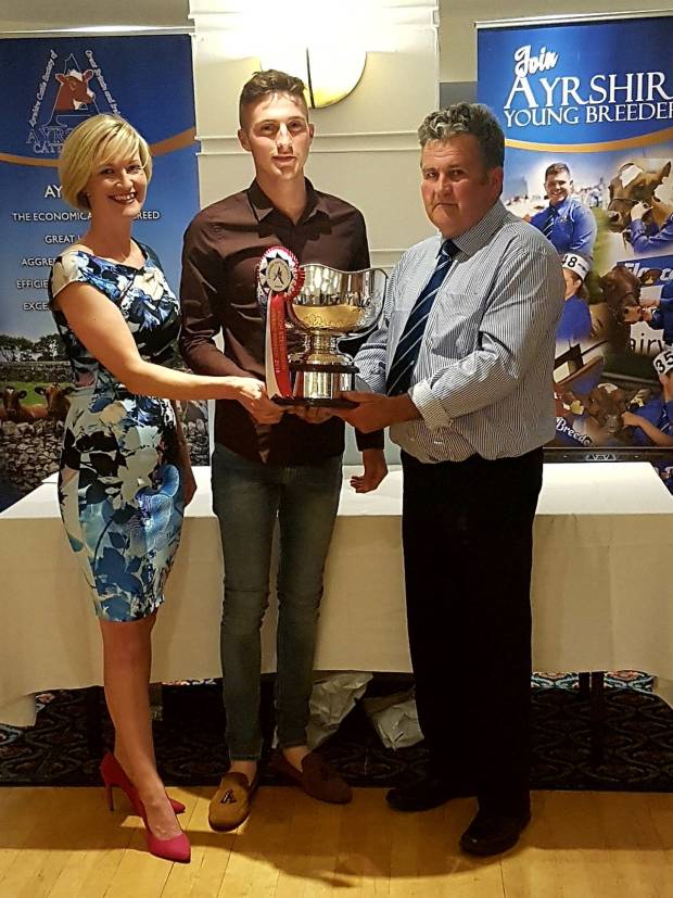 Hugh Stevenson award winner Shaun Rennie with President Keith Davidson and Vicki Silvera