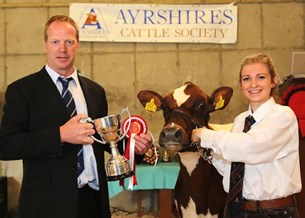 Champion handler, and winner of the mature showmanship class was Sarah Jones, Ballymena. Presenting the trophy is judge Peter Berresford. Picture by Jane Steel.