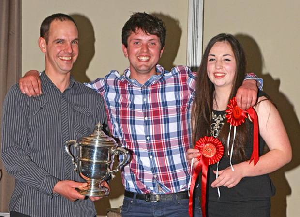 Darland Trophy Winners - Asher Bradley Seddon (middle) and Evie Tomlinson receiving their trophy from Michael Broadley