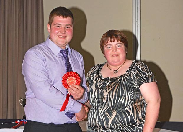 John McLean receiving his prize for the clipping section from Wendy Young